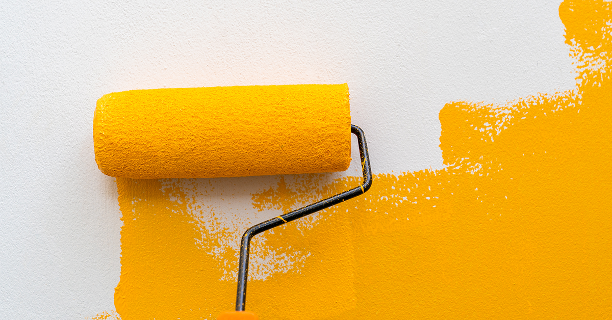 picture shows painting a wall with a roller